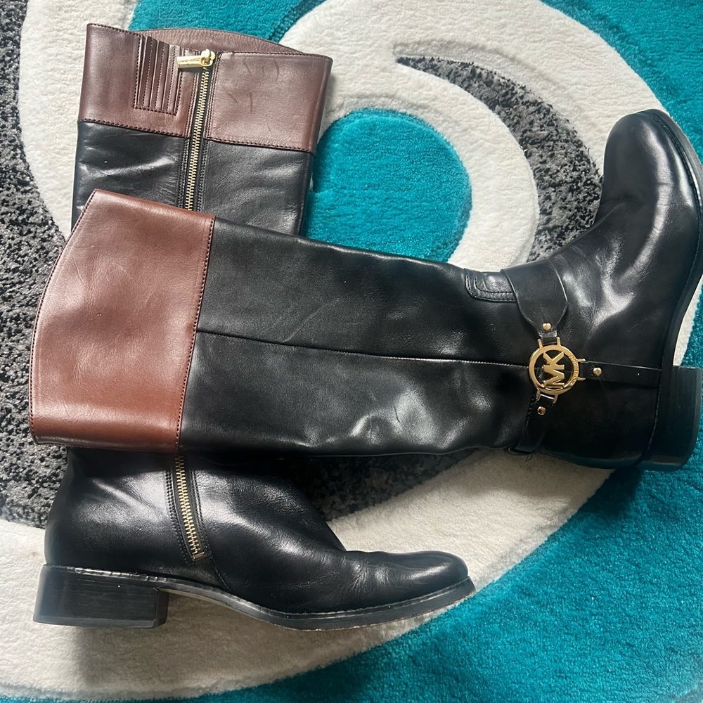 MICHAEL Michael Kors Black and Brown Heeled Boots with Equestrian Style.